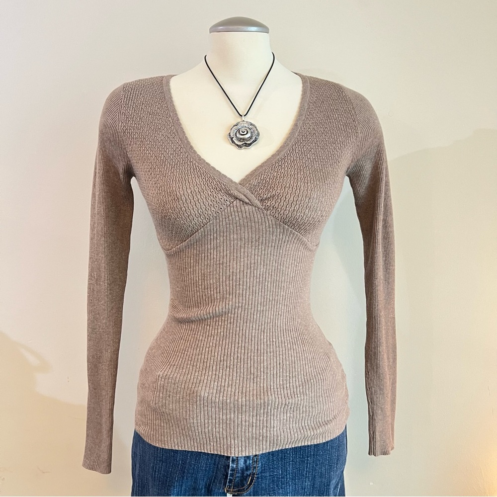 Brown ribbed wrap top with V-neckline and long sleeves